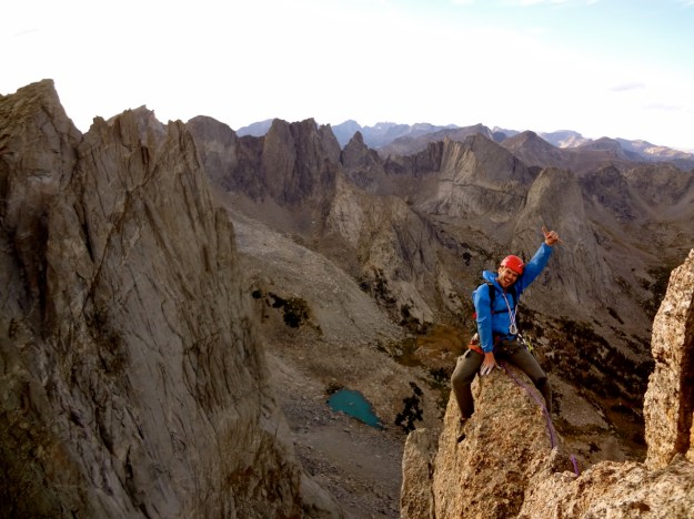 Floating on top of the feather, high above the range.