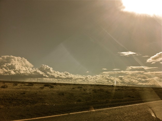 driving west, clouds